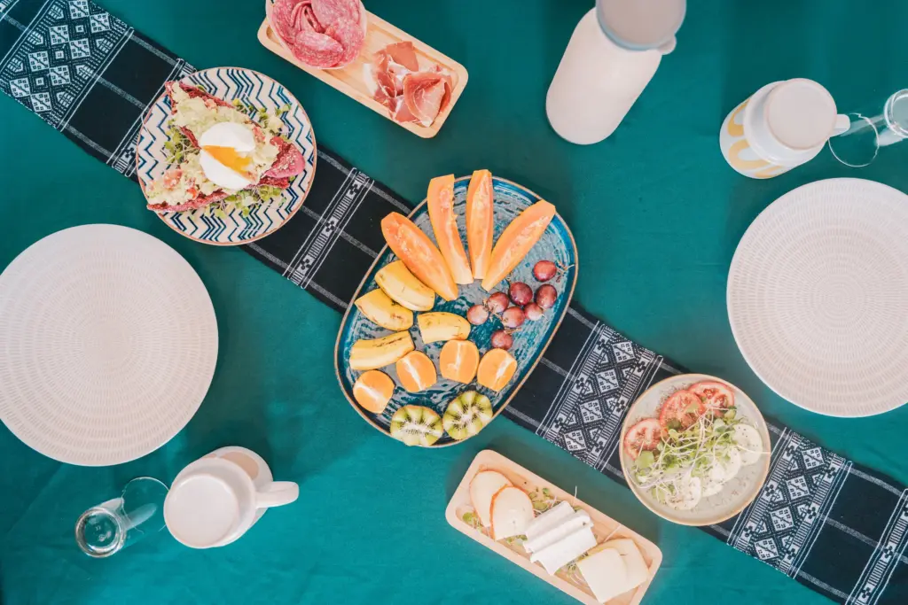 Colourful breakfast spread with fruit and fresh dishes at Casa Jardim di Sol